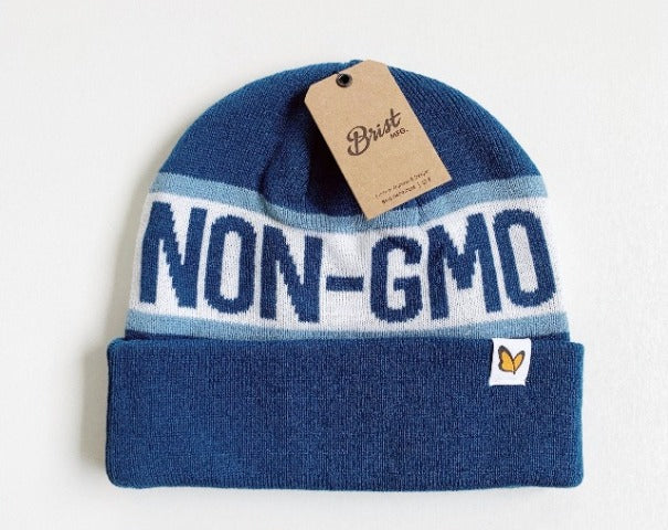 Navy Non-GMO Project beanie with  phrase "Non-GMO" and label of butterfly