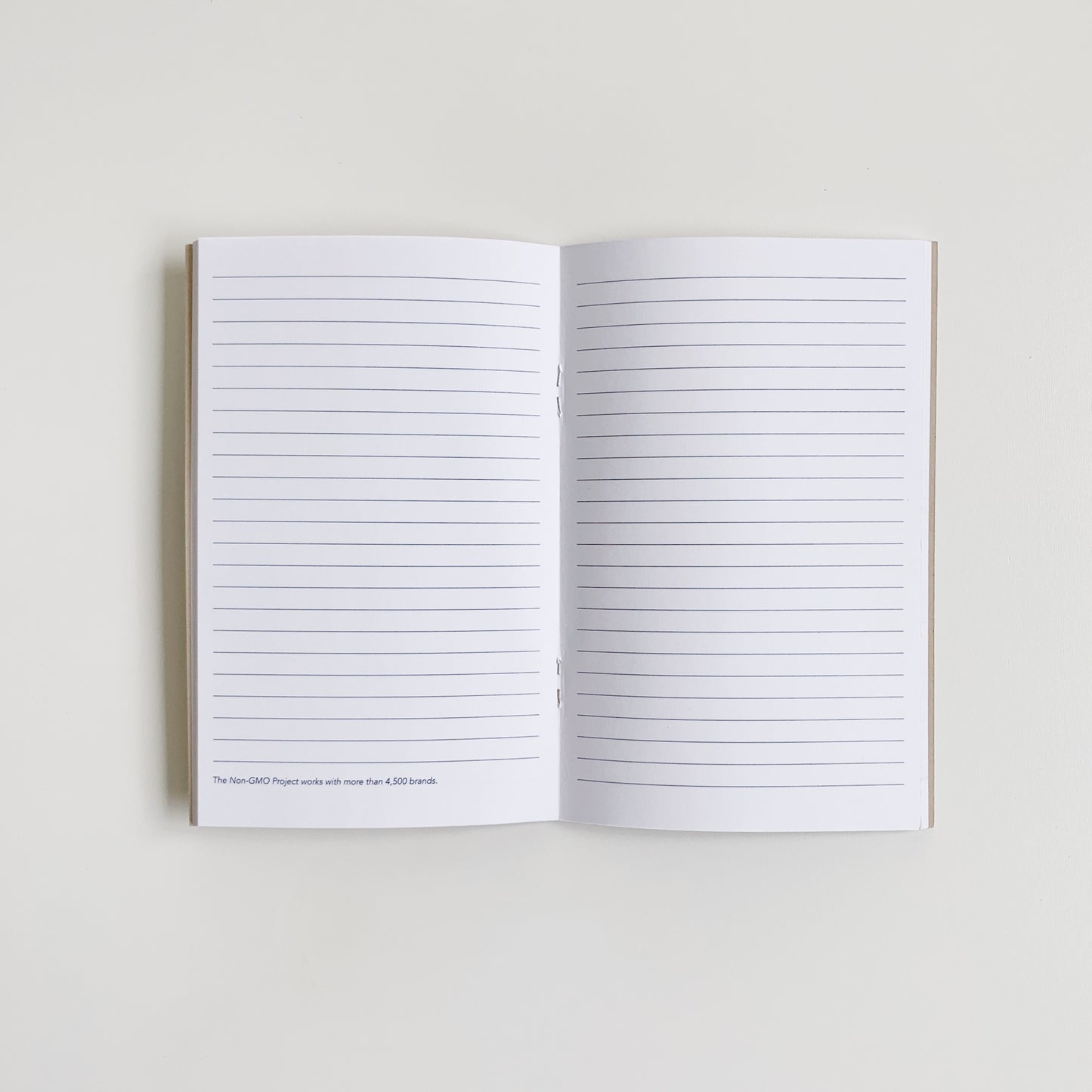 Non-GMO Project notebook open with lined pages
